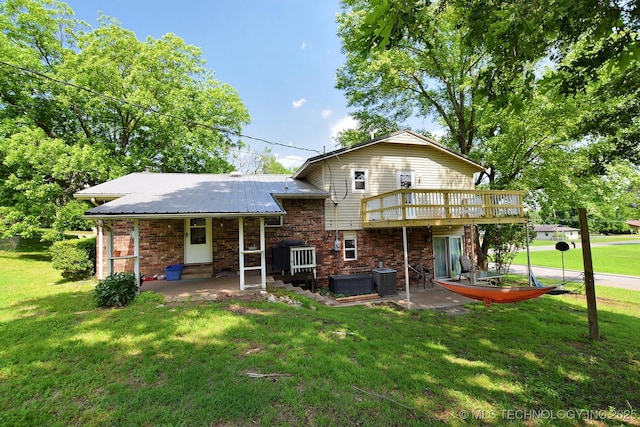1004 S Owens Ave, Tahlequah, OK 74464 - rear view of property featuring a yard, a deck, and a patio