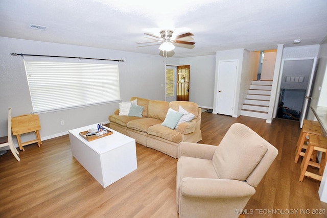 1004 S Owens Ave, Tahlequah, OK 74464 - living room with a ceiling fan, light wood-type flooring, stairway, and baseboards
