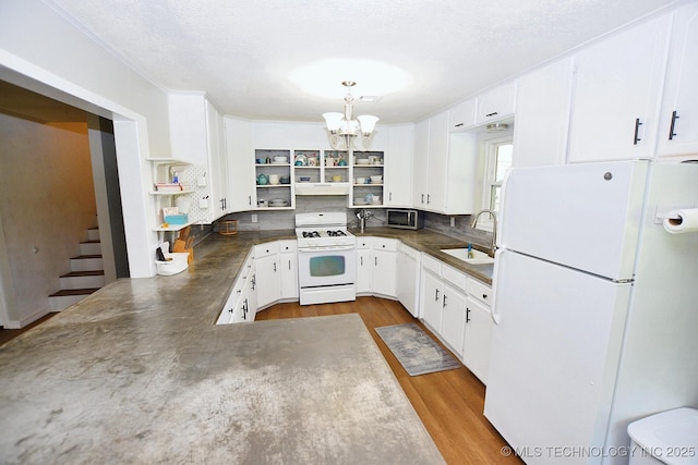 1004 S Owens Ave, Tahlequah, OK 74464 - kitchen with white appliances, open shelves, a sink, dark countertops, and a textured ceiling