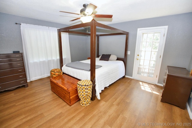 1004 S Owens Ave, Tahlequah, OK 74464 - bedroom with light wood-type flooring, baseboards, and ceiling fan