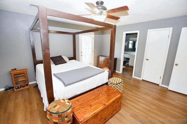 1004 S Owens Ave, Tahlequah, OK 74464 - bedroom featuring light wood-style flooring and baseboards