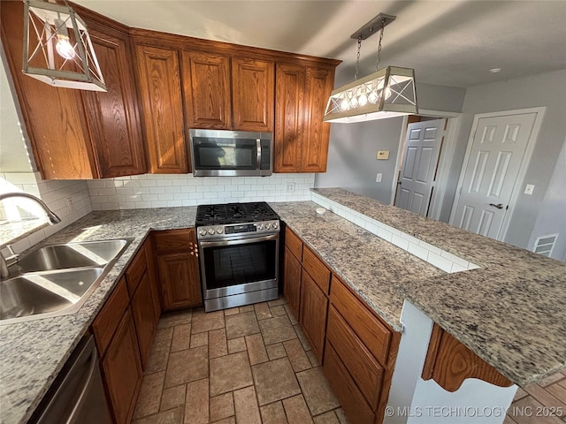 34 S Mount Calvary Rd, Hendrix, OK 74741 - kitchen with stainless steel appliances, a sink, backsplash, and a peninsula