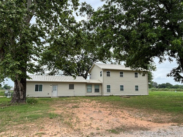 34 S Mount Calvary Rd, Hendrix, OK 74741 - rear view of house with metal roof and a yard