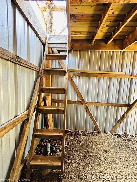 interior space featuring metal wall