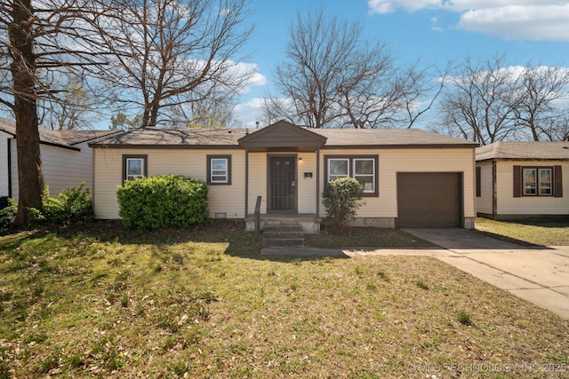 7380 E Independence St, Tulsa, OK 74115 - ranch-style home with a front yard, an attached garage, and driveway
