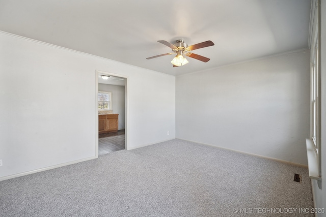 7380 E Independence St, Tulsa, OK 74115 - empty room with ceiling fan, baseboards, crown molding, and carpet