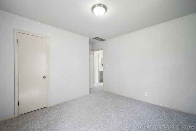 7380 E Independence St, Tulsa, OK 74115 - unfurnished room featuring baseboards, carpet, visible vents, and ornamental molding