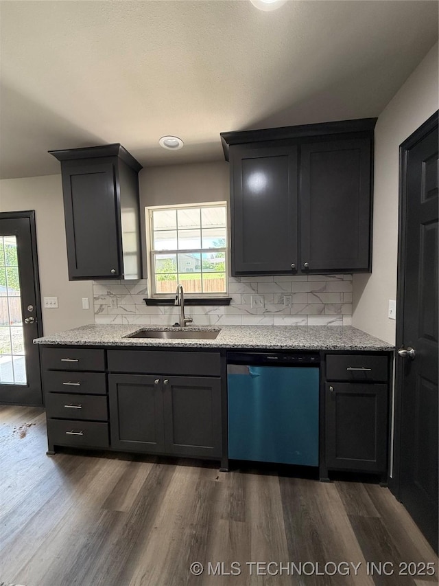 1103 S Chickasaw Pl, Claremore, OK 74017 - kitchen with dishwashing machine, backsplash, dark wood finished floors, and a sink