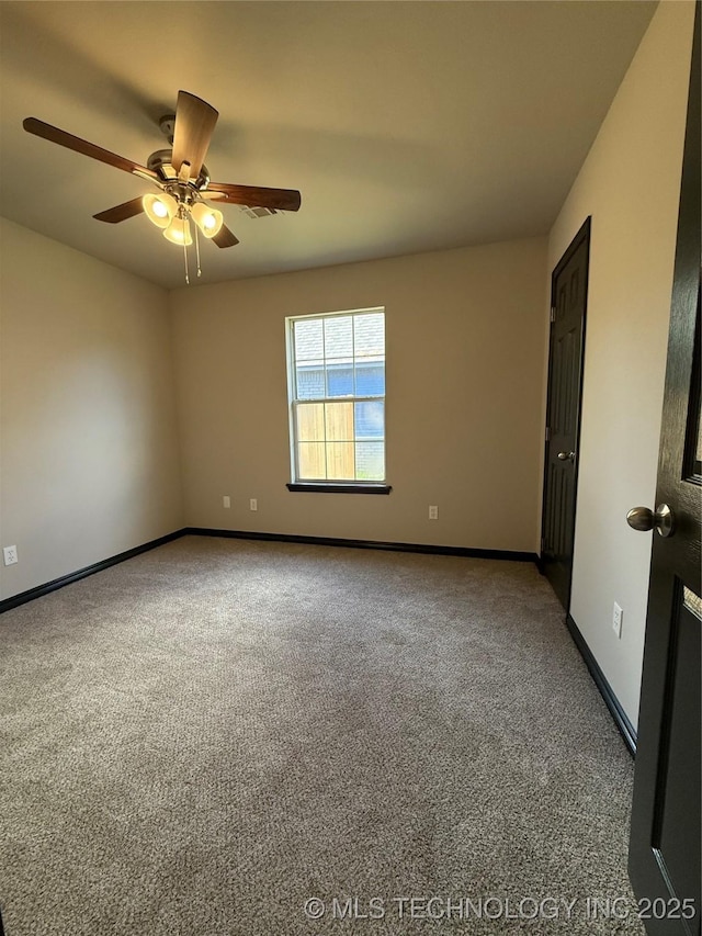 1103 S Chickasaw Pl, Claremore, OK 74017 - unfurnished room featuring carpet floors, baseboards, and ceiling fan