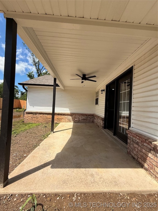 1103 S Chickasaw Pl, Claremore, OK 74017 - view of patio / terrace with ceiling fan and fence