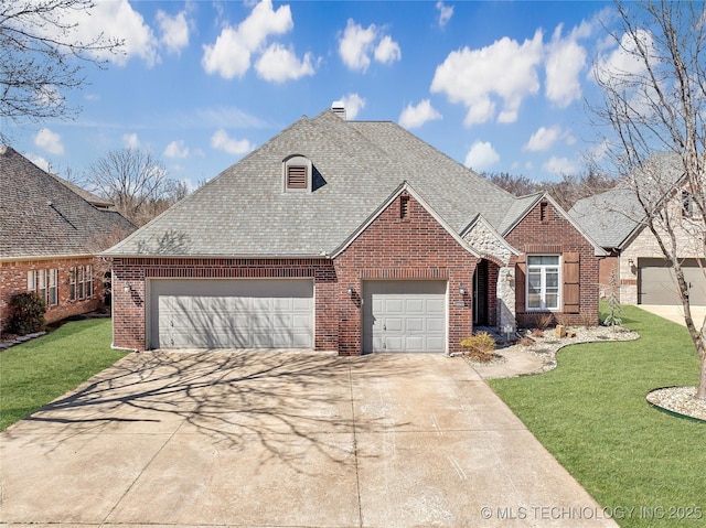 11727 S 91st E Ave, Bixby, OK 74008 - view of front facade with brick siding, an attached garage, concrete driveway, and a front lawn