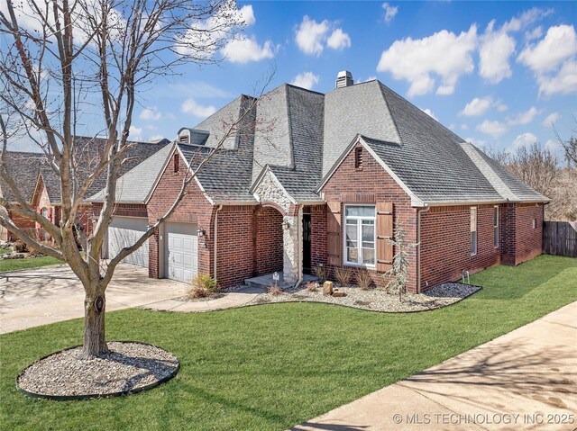 11727 S 91st E Ave, Bixby, OK 74008 - view of front of home featuring brick siding, a garage, driveway, and a chimney