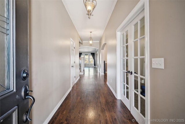 11727 S 91st E Ave, Bixby, OK 74008 - entrance foyer with ornamental molding, arched walkways, dark wood-style floors, baseboards, and french doors