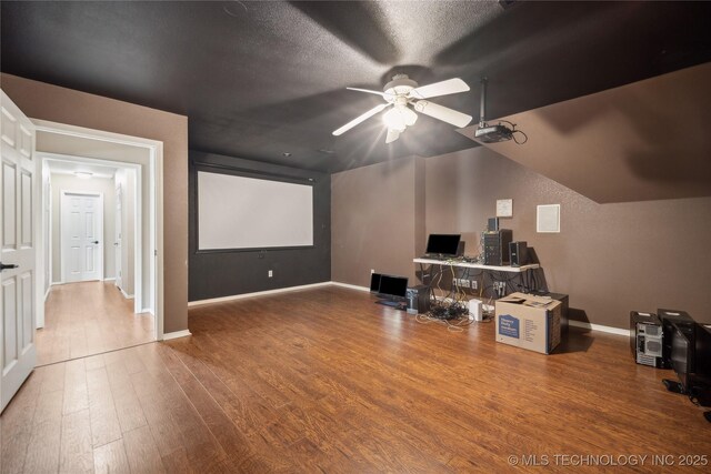 11727 S 91st E Ave, Bixby, OK 74008 - home theater room featuring a ceiling fan, wood finished floors, and baseboards