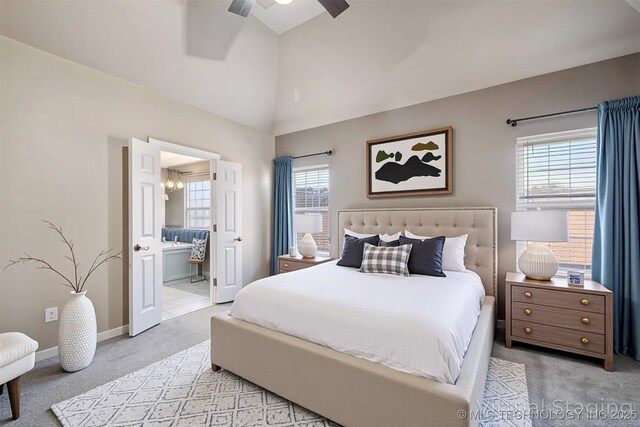 11727 S 91st E Ave, Bixby, OK 74008 - bedroom featuring light colored carpet, multiple windows, a chandelier, connected bathroom, and high vaulted ceiling