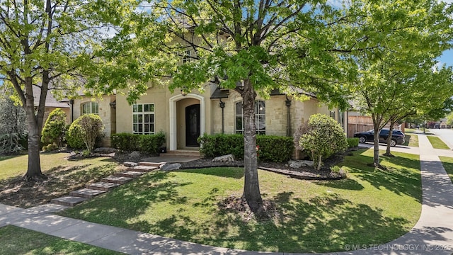 10848 S 95th E Ave, Tulsa, OK 74133 - view of property hidden behind natural elements with stucco siding and a front yard