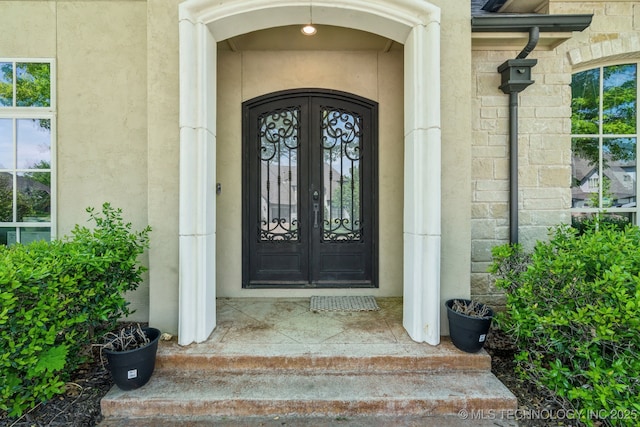 10848 S 95th E Ave, Tulsa, OK 74133 - property entrance featuring stone siding and stucco siding