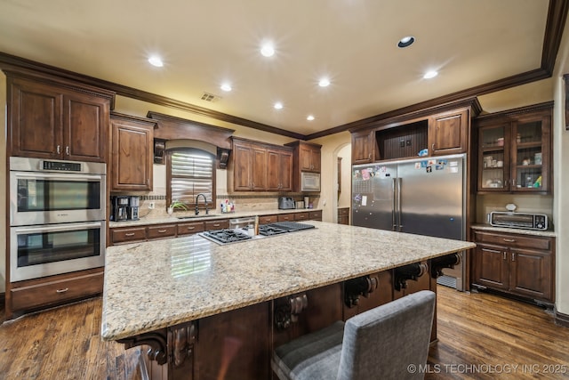 10848 S 95th E Ave, Tulsa, OK 74133 - kitchen featuring built in appliances, a sink, and crown molding