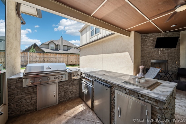 10848 S 95th E Ave, Tulsa, OK 74133 - view of patio with fence, grilling area, a ceiling fan, and area for grilling