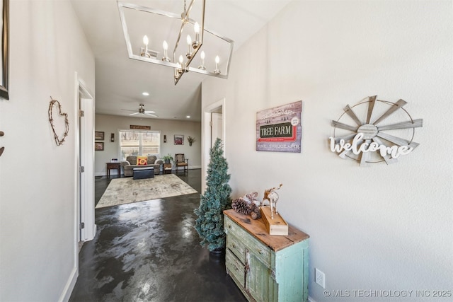 11210 W 178th St, Skiatook, OK 74070 - hallway with concrete flooring, a chandelier, and baseboards