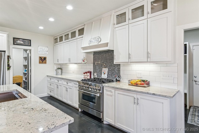 11210 W 178th St, Skiatook, OK 74070 - kitchen featuring stainless steel appliances, white cabinets, backsplash, and recessed lighting