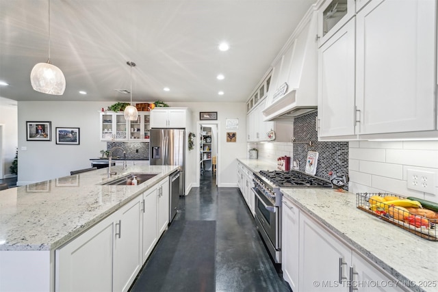 11210 W 178th St, Skiatook, OK 74070 - kitchen featuring appliances with stainless steel finishes, a sink, recessed lighting, tasteful backsplash, and custom range hood