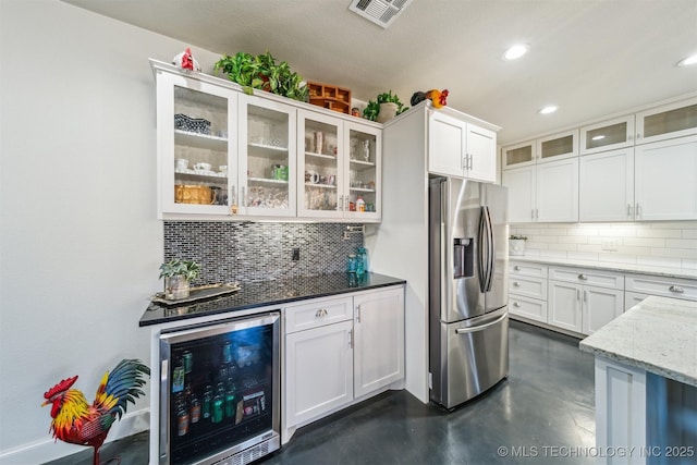 11210 W 178th St, Skiatook, OK 74070 - kitchen with stainless steel fridge with ice dispenser, beverage cooler, tasteful backsplash, white cabinetry, and recessed lighting