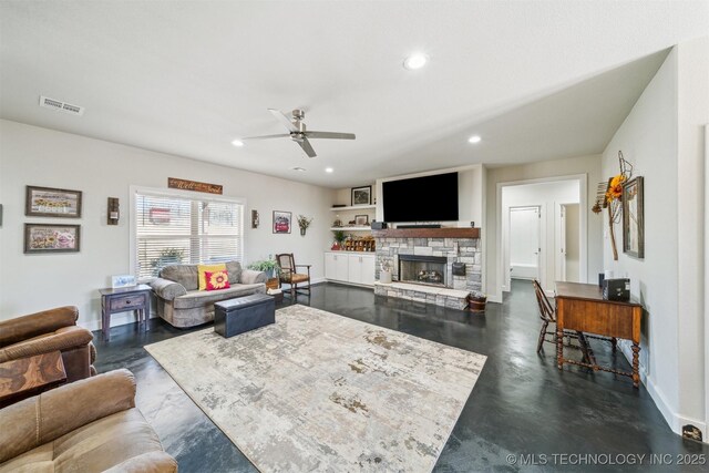 11210 W 178th St, Skiatook, OK 74070 - living area featuring ceiling fan, recessed lighting, a stone fireplace, baseboards, and concrete floors