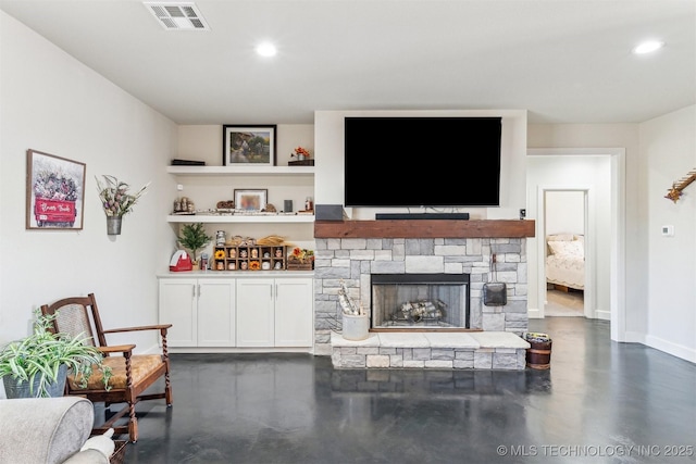 11210 W 178th St, Skiatook, OK 74070 - living area featuring concrete flooring, recessed lighting, baseboards, and a stone fireplace