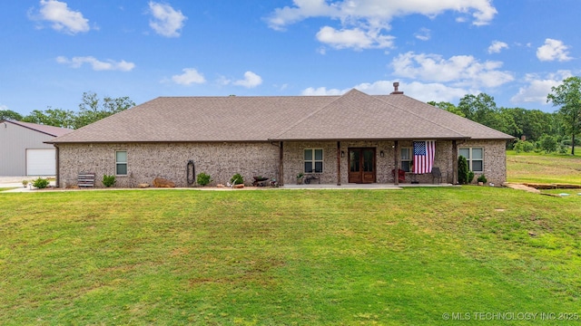 11210 W 178th St, Skiatook, OK 74070 - view of front of house with a front lawn, a garage, a chimney, and roof with shingles