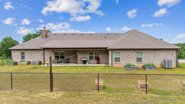11210 W 178th St, Skiatook, OK 74070 - rear view of house with central AC unit, a patio, brick siding, and a chimney