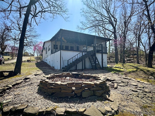 view of outbuilding featuring stairway
