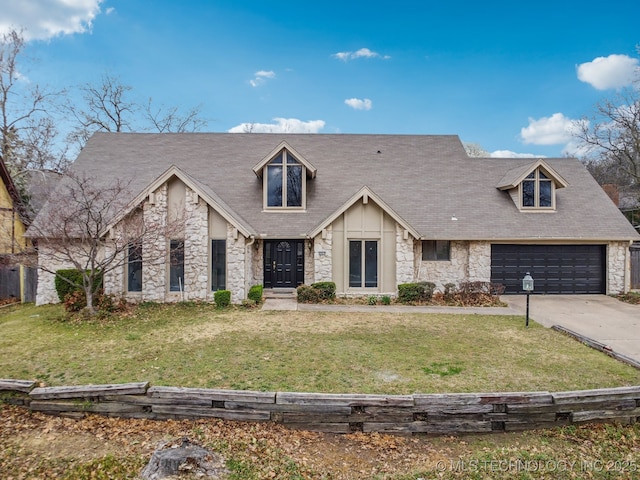 6924 S Knoxville Ave, Tulsa, OK 74136 - view of front of house with stone siding, a front lawn, driveway, and a garage
