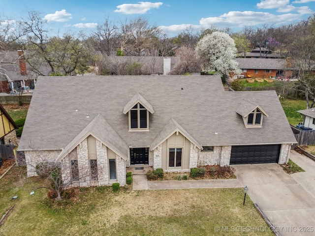 6924 S Knoxville Ave, Tulsa, OK 74136 - view of front of property with stone siding, driveway, and a garage