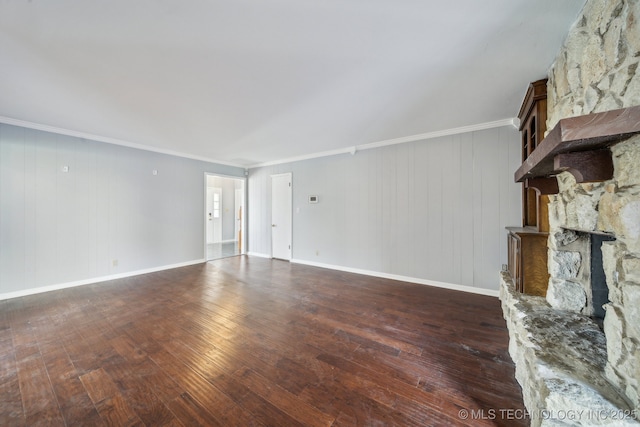 6924 S Knoxville Ave, Tulsa, OK 74136 - unfurnished living room featuring ornamental molding, wood-type flooring, and a stone fireplace