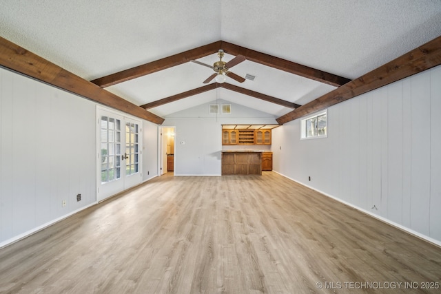 6924 S Knoxville Ave, Tulsa, OK 74136 - unfurnished living room featuring light wood finished floors, ceiling fan, and a textured ceiling