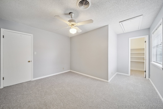 6924 S Knoxville Ave, Tulsa, OK 74136 - carpeted spare room with attic access, ceiling fan, and a textured ceiling