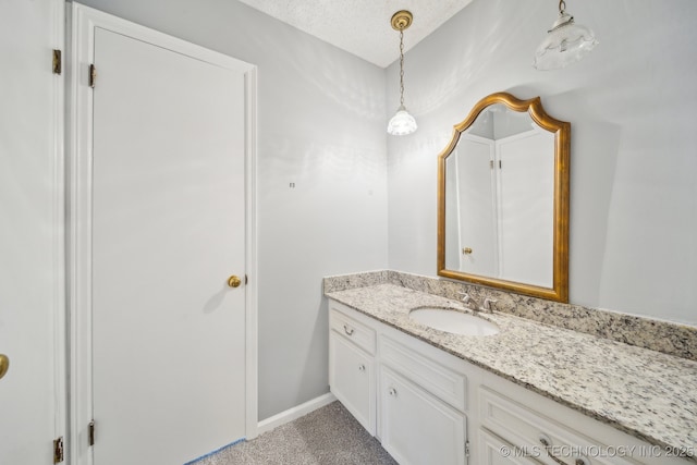 6924 S Knoxville Ave, Tulsa, OK 74136 - bathroom featuring vanity and a textured ceiling