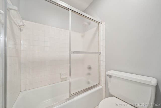 6924 S Knoxville Ave, Tulsa, OK 74136 - bathroom with toilet and combined bath / shower with glass door