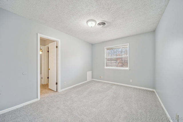 6924 S Knoxville Ave, Tulsa, OK 74136 - carpeted empty room featuring baseboards and a textured ceiling