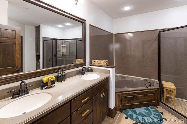 bathroom featuring a bath, a sink, double vanity, and a stall shower