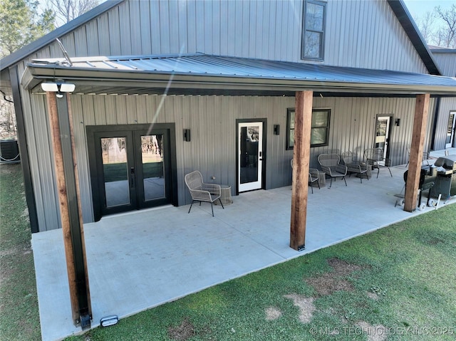 117700 S 4214th Rd, Eufaula, OK 74432 - back of property with a patio, french doors, board and batten siding, and an outdoor hangout area