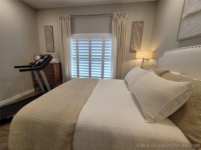 117700 S 4214th Rd, Eufaula, OK 74432 - bedroom featuring wood finished floors and baseboards
