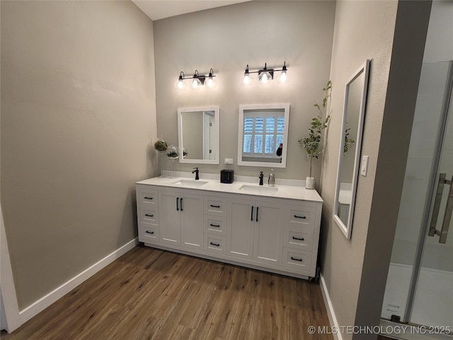 117700 S 4214th Rd, Eufaula, OK 74432 - bathroom with wood finished floors, double vanity, and baseboards