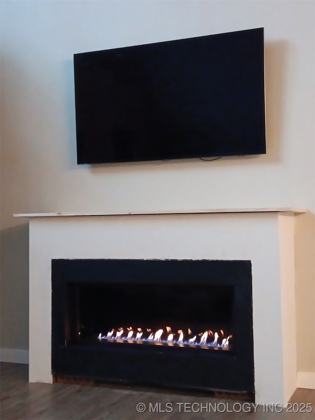 117700 S 4214th Rd, Eufaula, OK 74432 - detailed view of a fireplace, wood finished floors, and baseboards