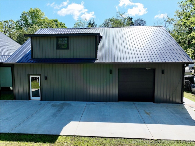 117700 S 4214th Rd, Eufaula, OK 74432 - view of front facade featuring metal roof, concrete driveway, and a detached garage