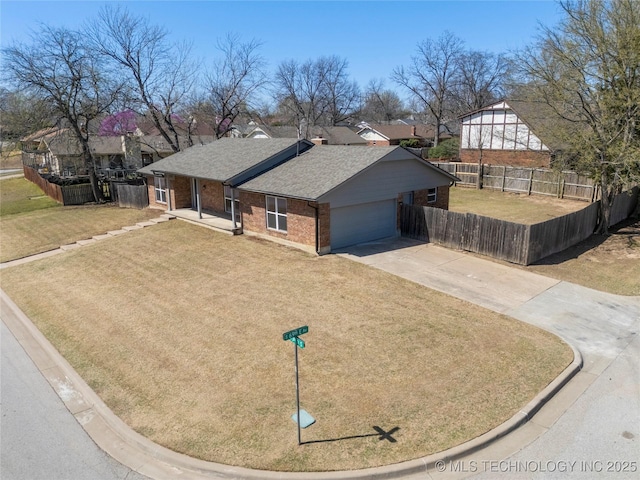 view of front facade featuring fence, roof with shingles, concrete driveway, an attached garage, and brick siding