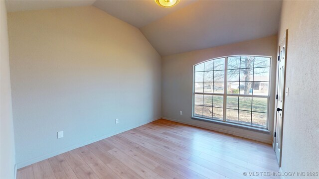 11762 N 156th E Ave, Collinsville, OK 74021 - empty room with light wood-type flooring, vaulted ceiling, and baseboards
