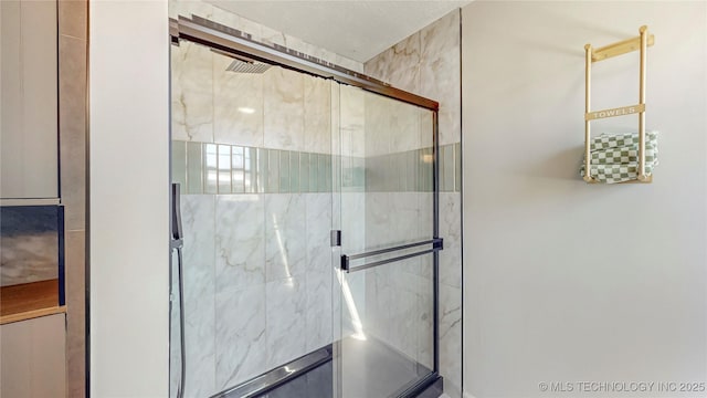 bathroom with a shower stall
