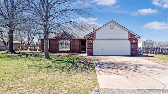 ranch-style home featuring concrete driveway, fence, an attached garage, a front yard, and brick siding